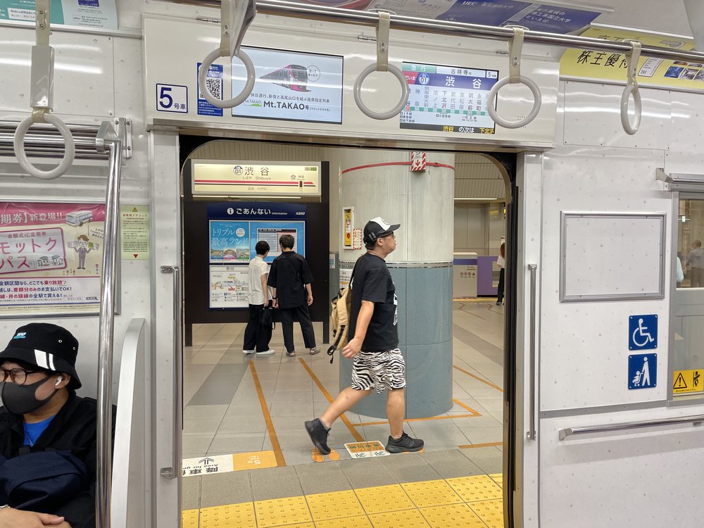 pov inside a subway train in shibuya