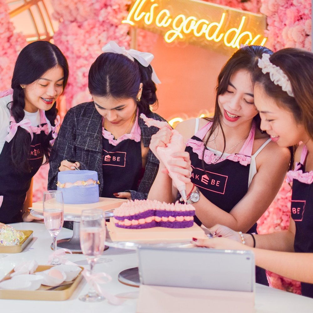 Girls decorating cake