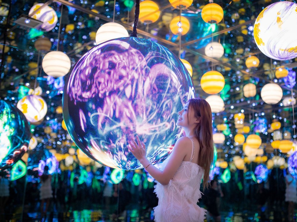 Girl holding a big ball of light