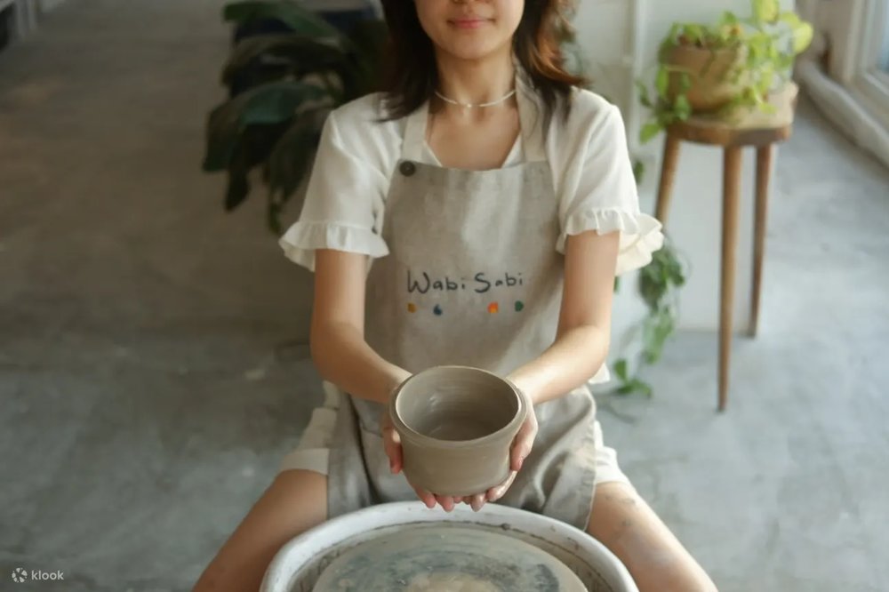 Girl making pots