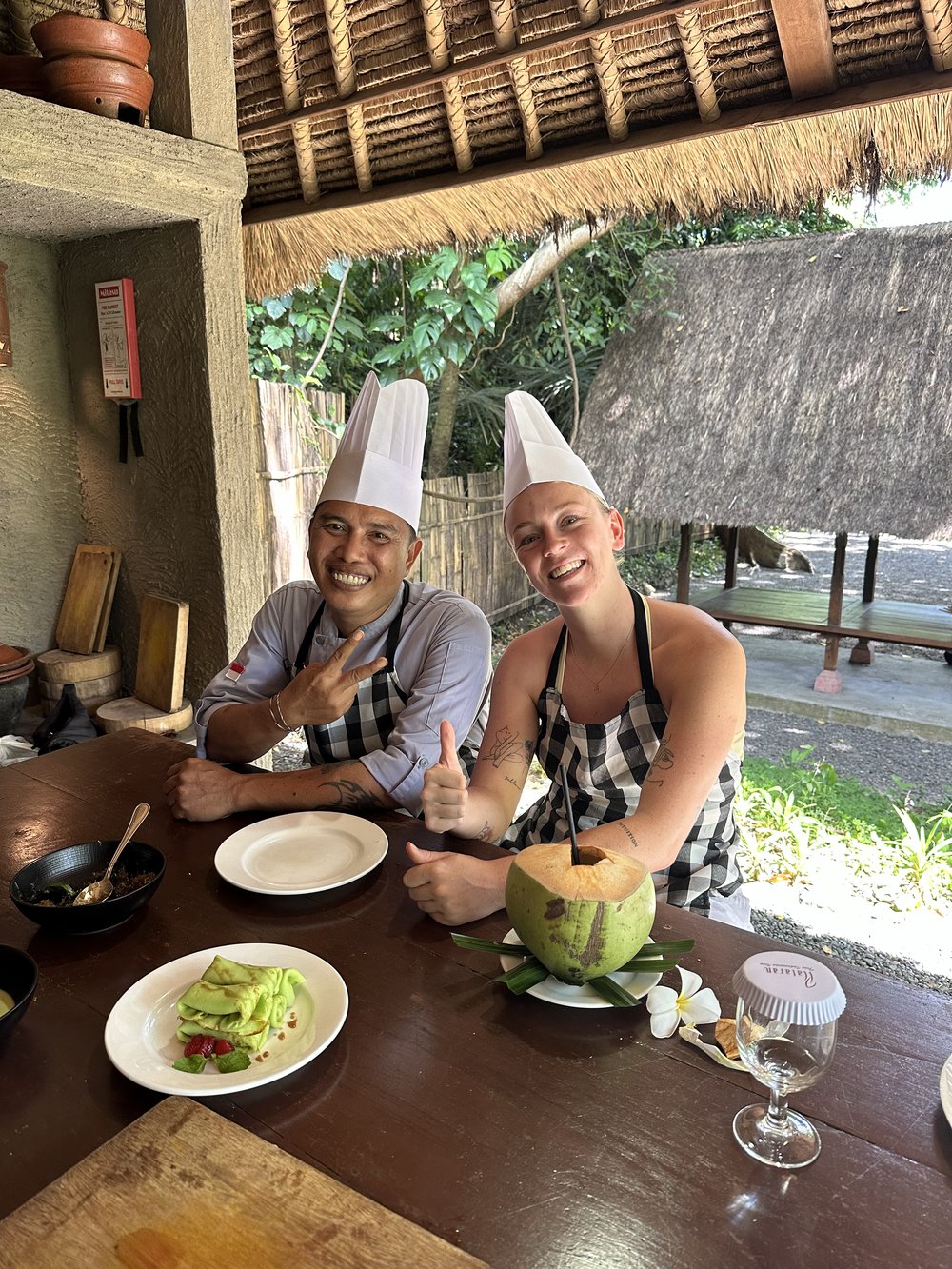 two people in chef hats in bali