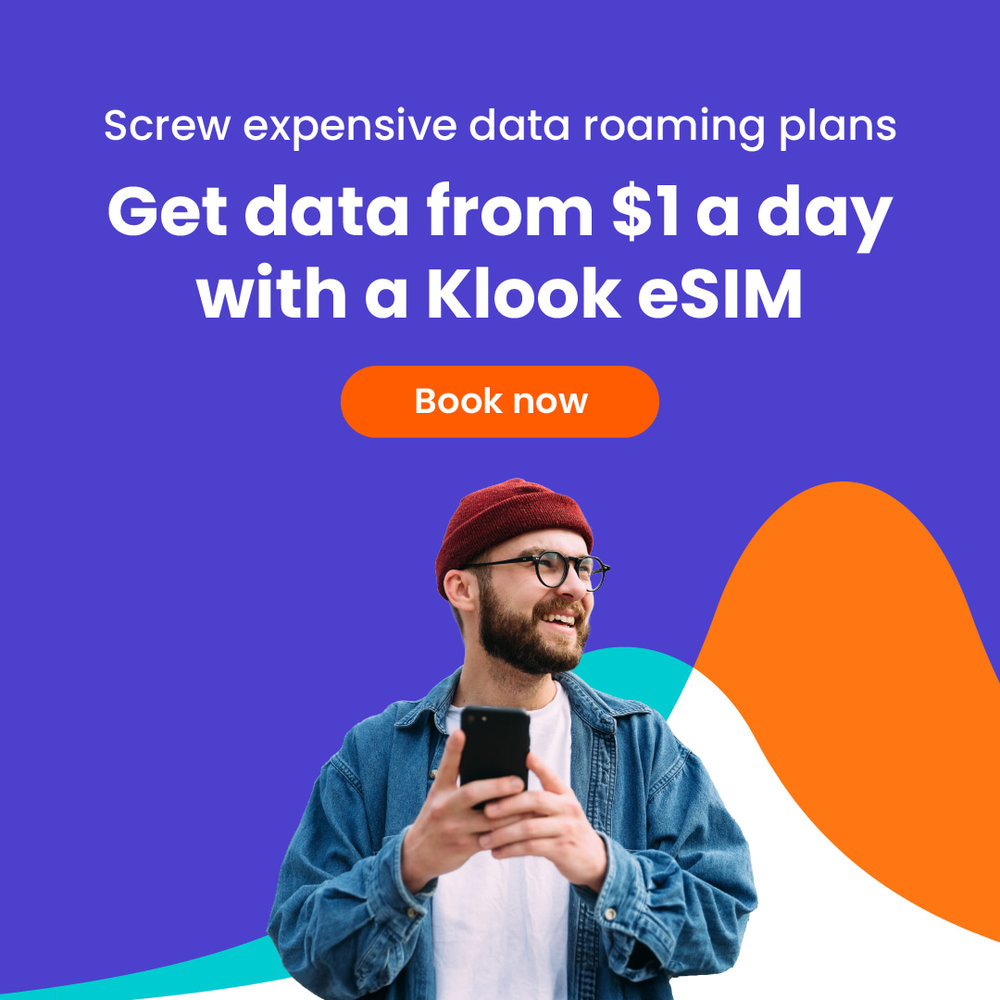 man holding a cellphone with text talking about how klook eSims are cheaper than the usual data roaming plans