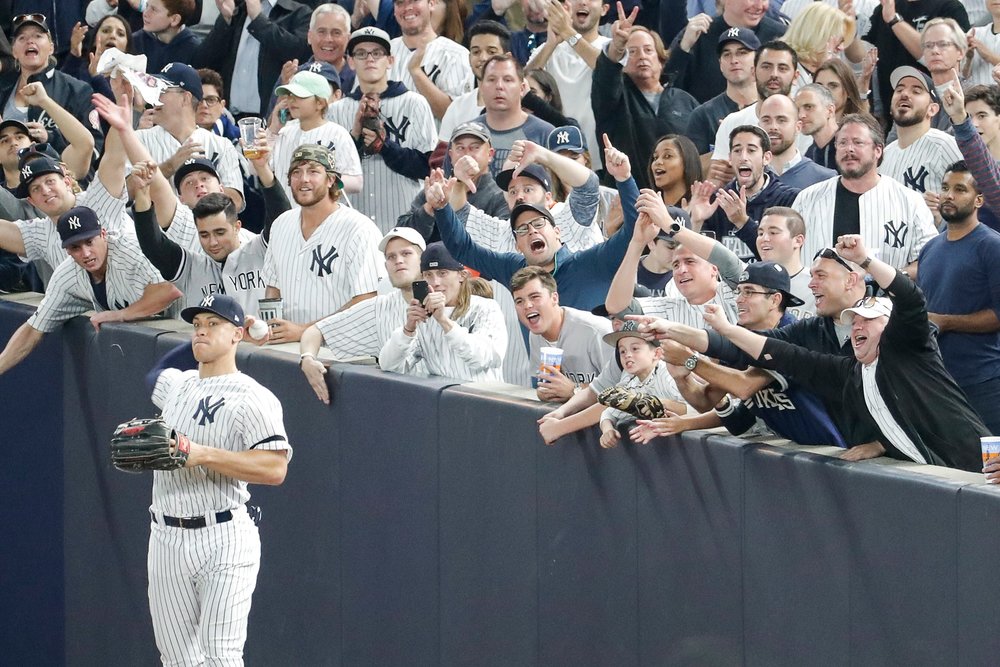 yankees player with crowd cheering in the background