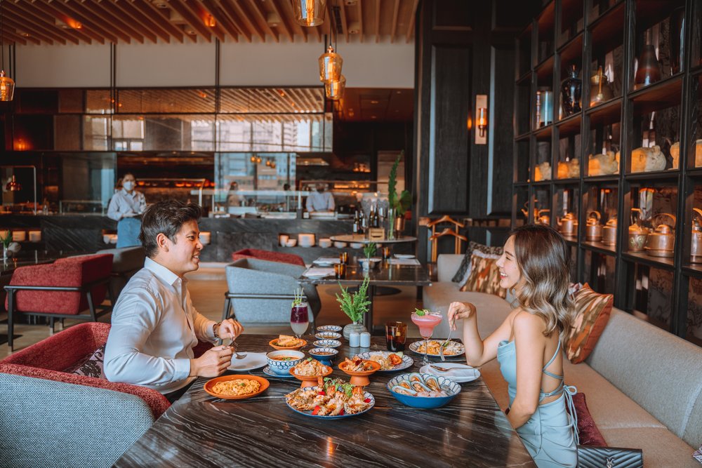 couple eating at market cafe