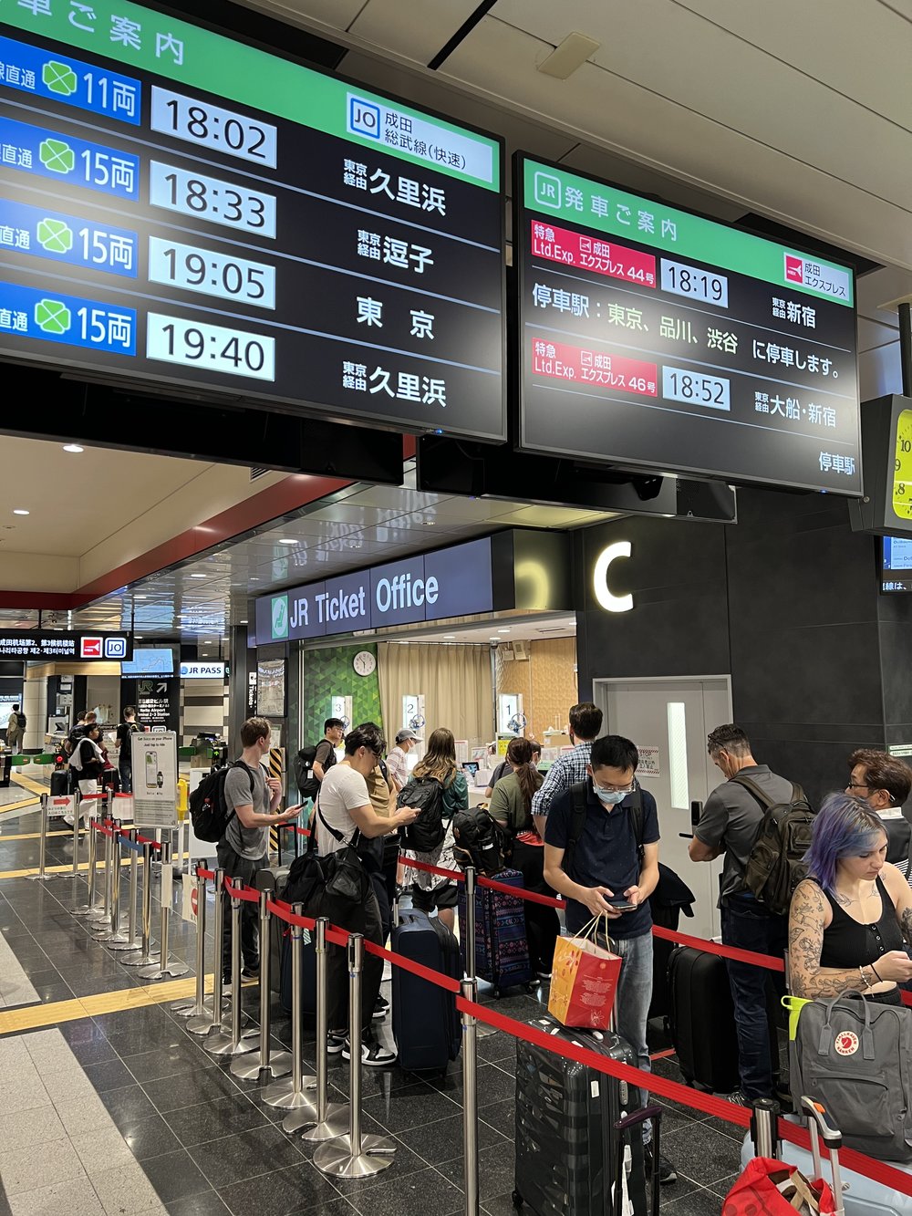 people lining up in ticket office
