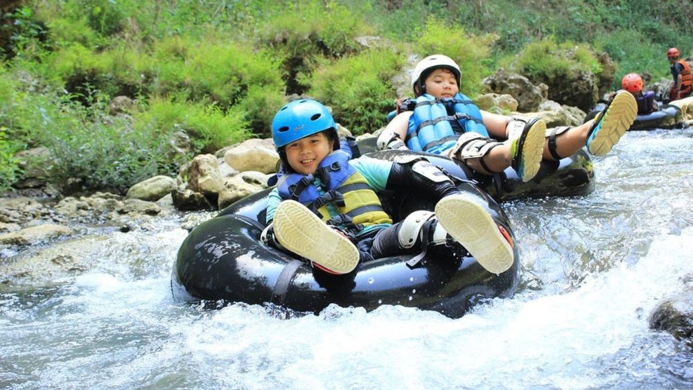Slip and slide through all 4.5 kilometres of the Pakerisan River.  Image credits: @kalisucicavetubing on Instagram