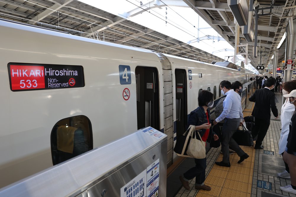 people entering the shinkansen in hiroshima