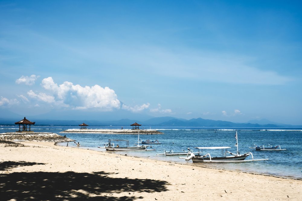 sanur bali - white boats in the beachside 
