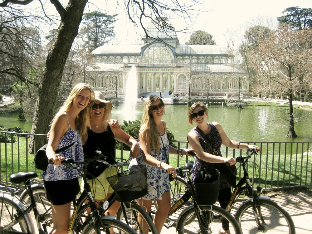women biking around in madrid