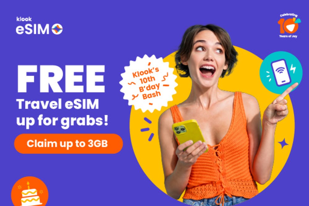 woman holding a phone with copy telling the reader that they can get free travel esims