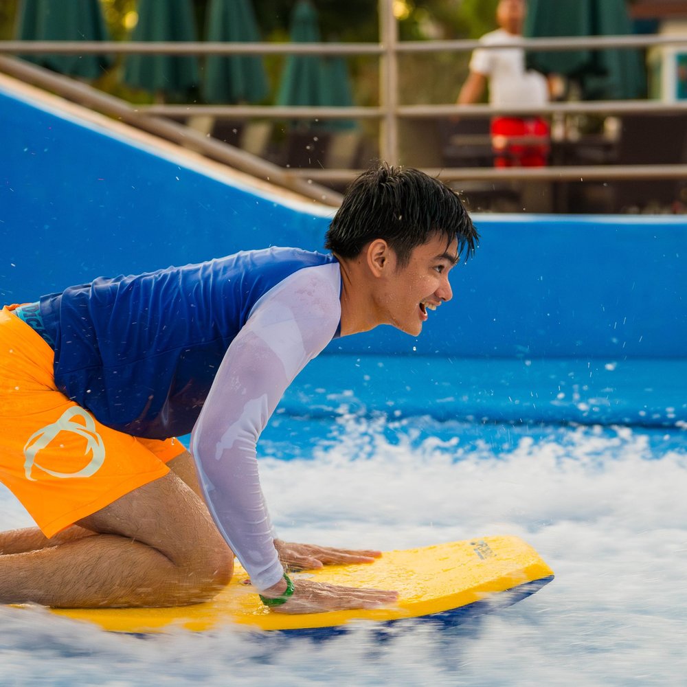 Sideview of a guy trying the flow rider