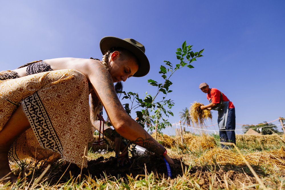 Woman planting at Wonderfruit