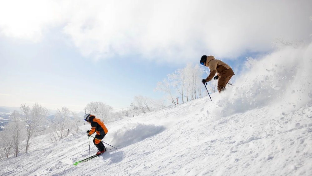 People Skiing down slope