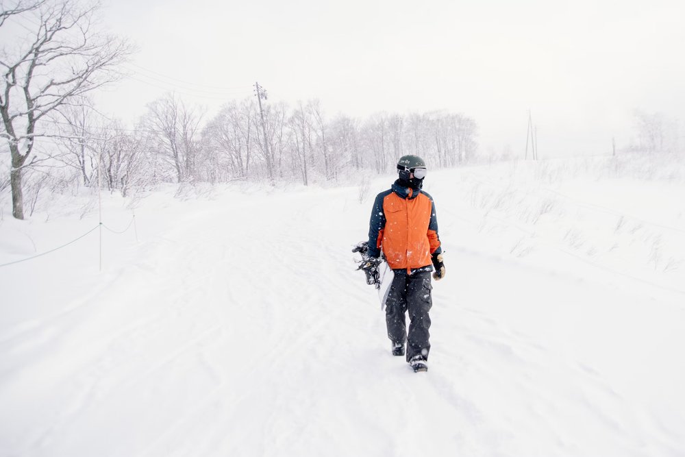 man walking in snow