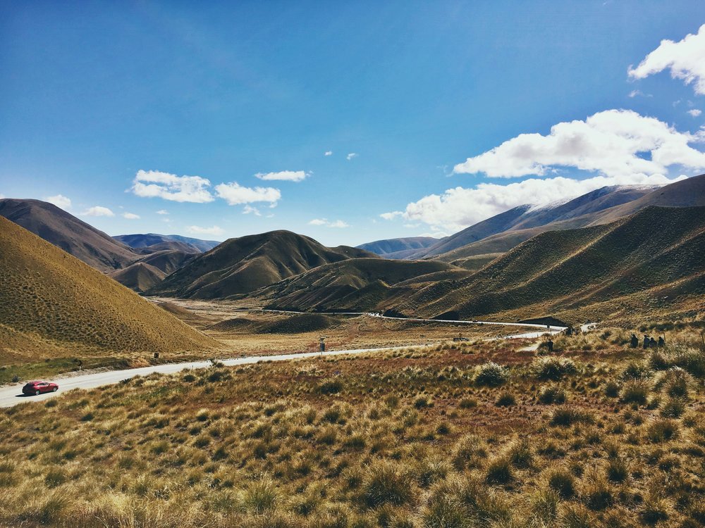 New Zealand South Island Road Trip Itinerary - A car driving through Lindis Pass