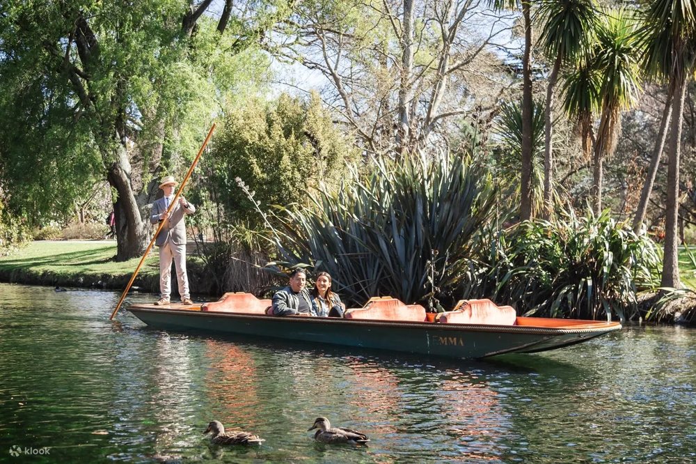 New Zealand South Island Road Trip Itinerary - Travelers punting on the Avon River in Christchurch