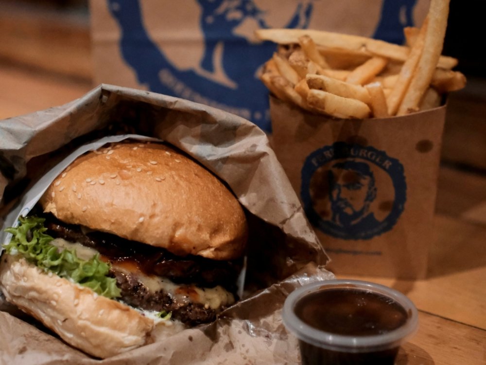 New Zealand South Island Road Trip Itinerary - Close-up of a burger and fries from Fergburger in Queenstown