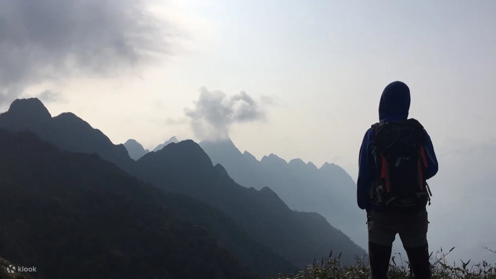 Guy in the peak of Fansipan Mountain