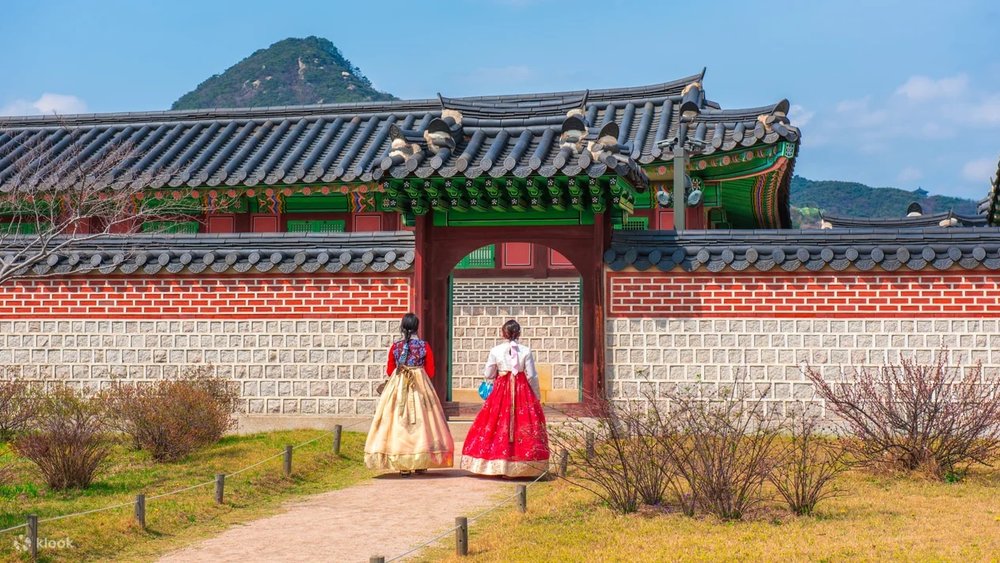 two girls entering a korean castle