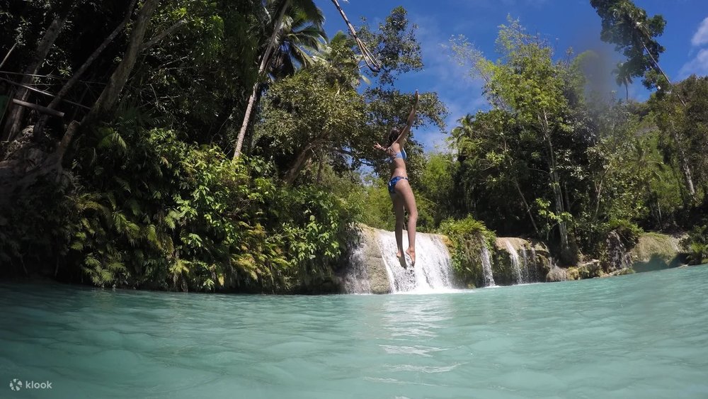 Girl jumping in the water