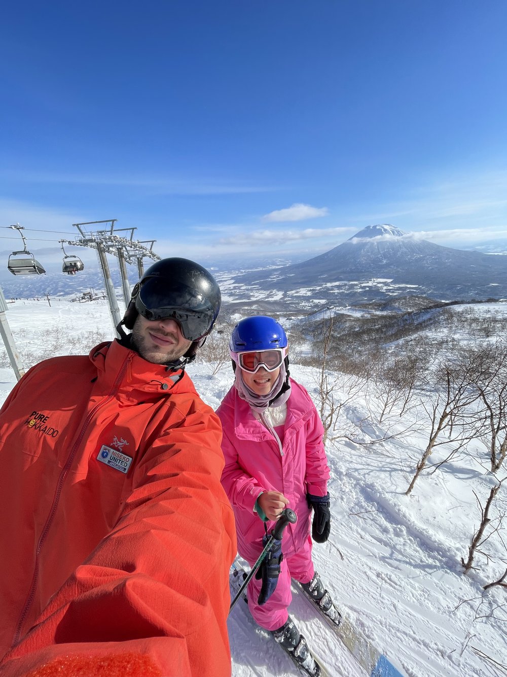 two skiers on a mountain