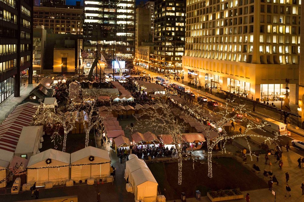 Birds eye view of lighted tents at night