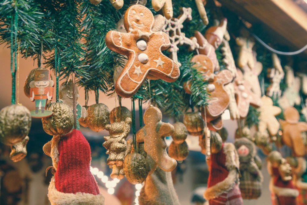Gingerbread cookies hanging along a tree
