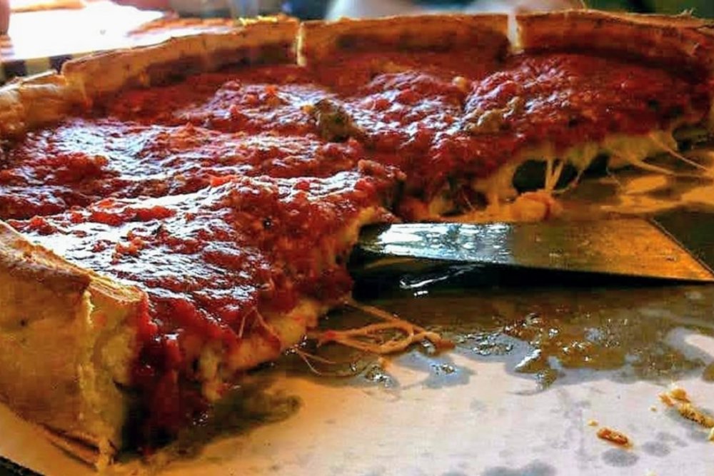 Sliced deep dish pizza