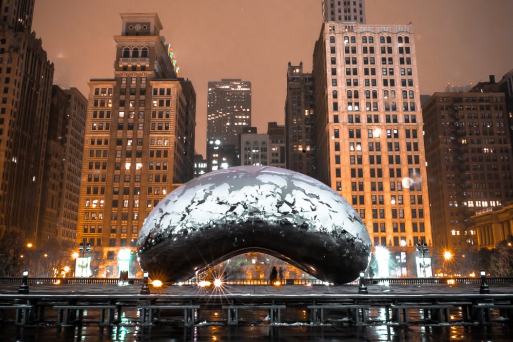 metal structure in front of city buildings