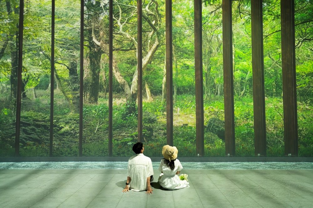 Things to do in Jeju South Korea - Couple sitting in Garden exhibition Arte Museum