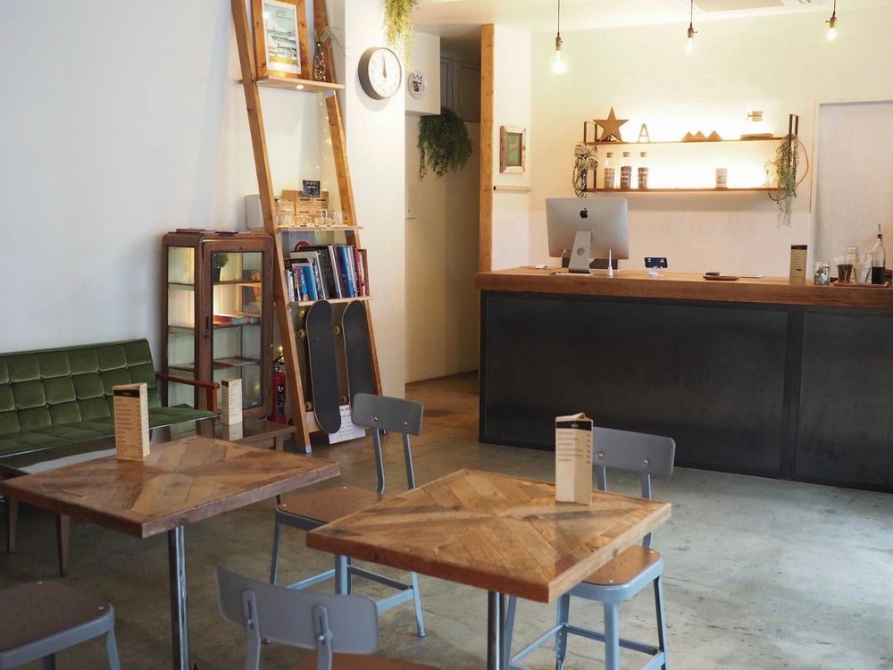 empty chairs and tables inside a room