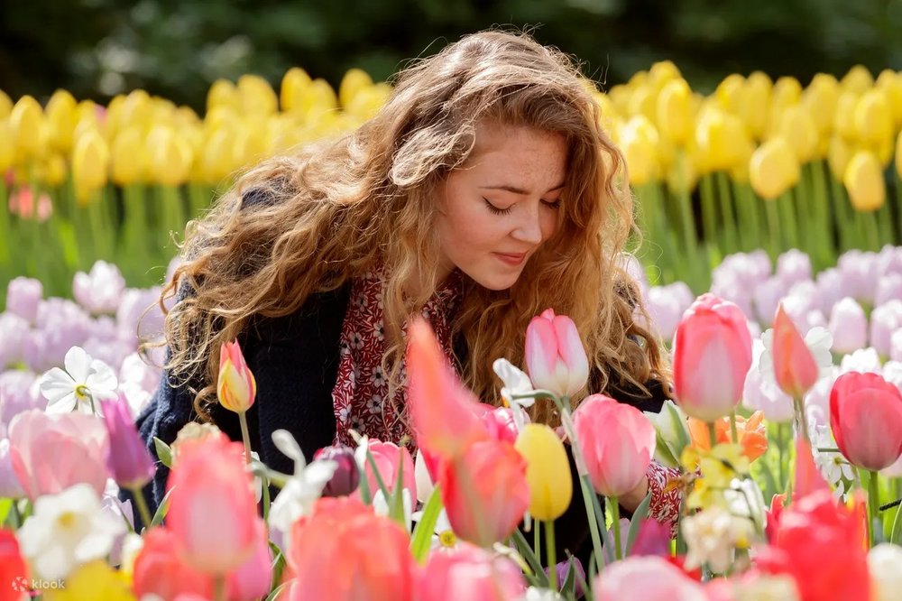 Girl smelling a flower
