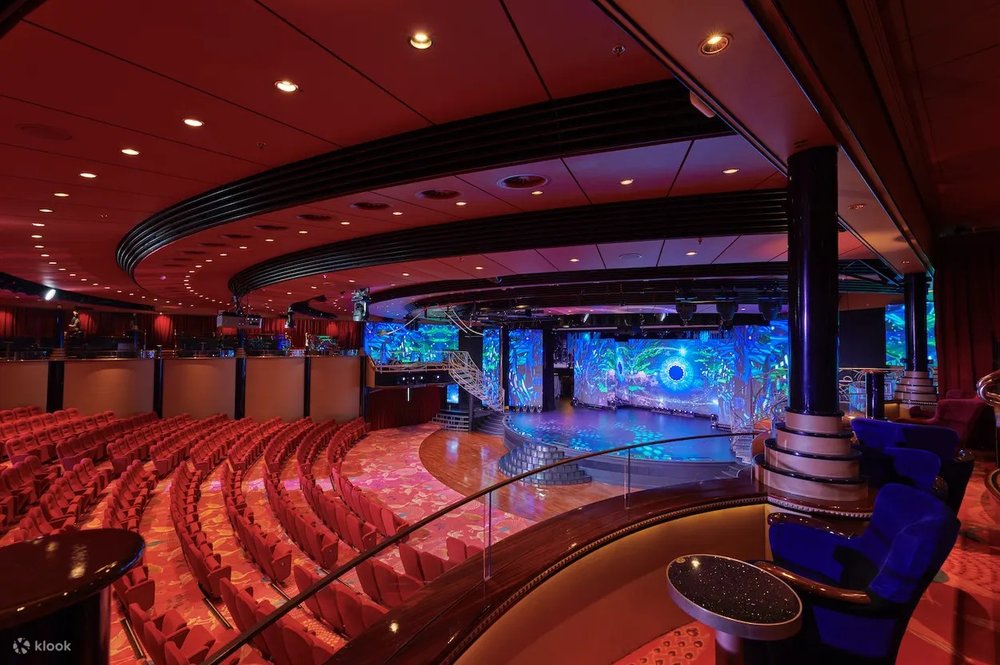 Keep yourself entertained onboard with live shows and signature production shows at the Zodiac Theatre. Credits : Klook