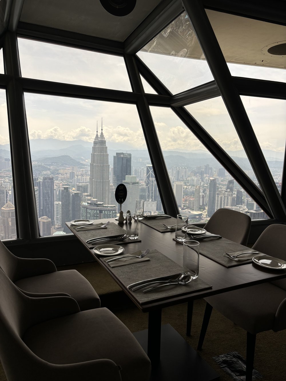 ORBIT Revolving Dining - Table with KLCC view