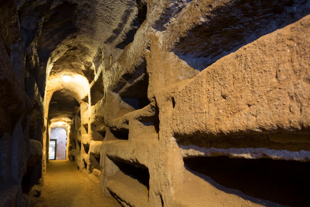 rome at night - stone walls in a dimly lit corridor