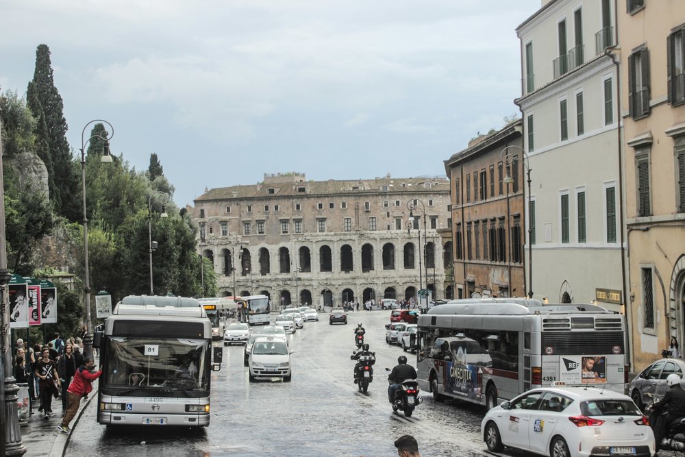 rome italy bus - street view with buildings and buses