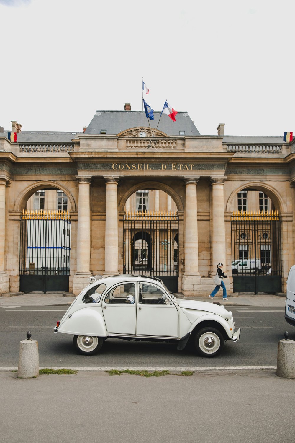 paris at night - vintage car in front of building in paris, france