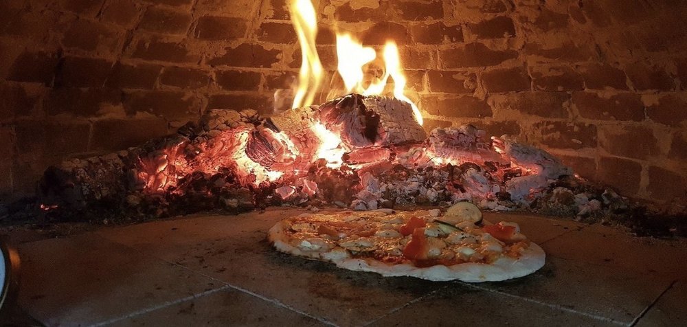 [usxanz] cheap food in rome italy - plate of food in front of a fire