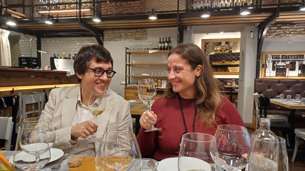 A couple having wine in Rome