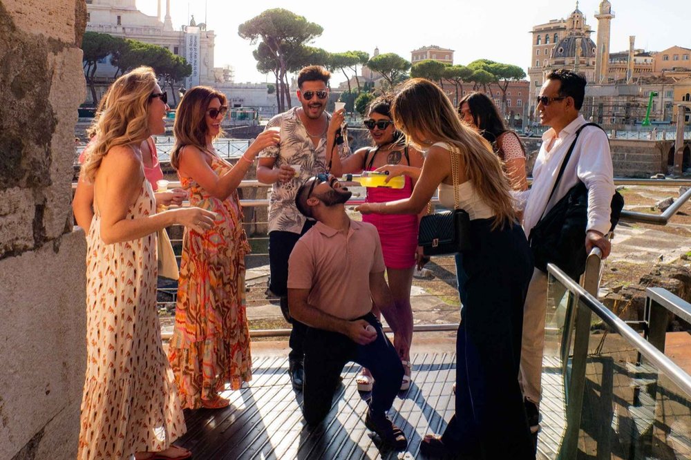A group of friends laughing together in Rome