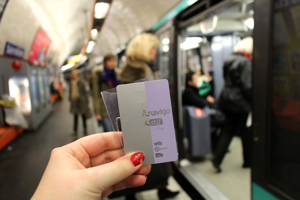 Holding a Navigo Travel Pass in the Paris Metro