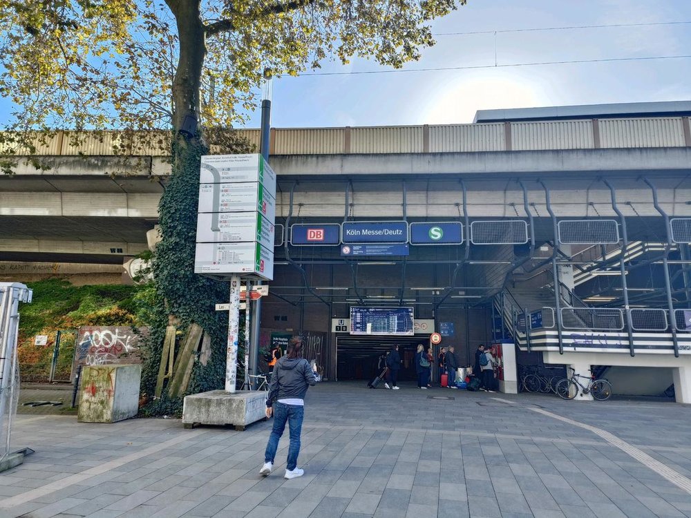person checking out commuting signs in cologne