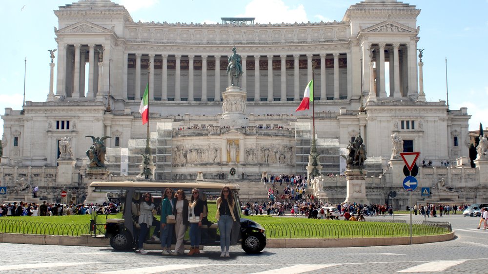 riding a golf cart to tour rome