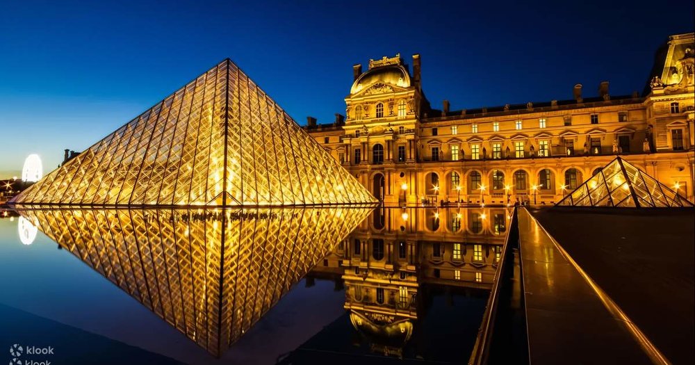 exterior of the louvre at night