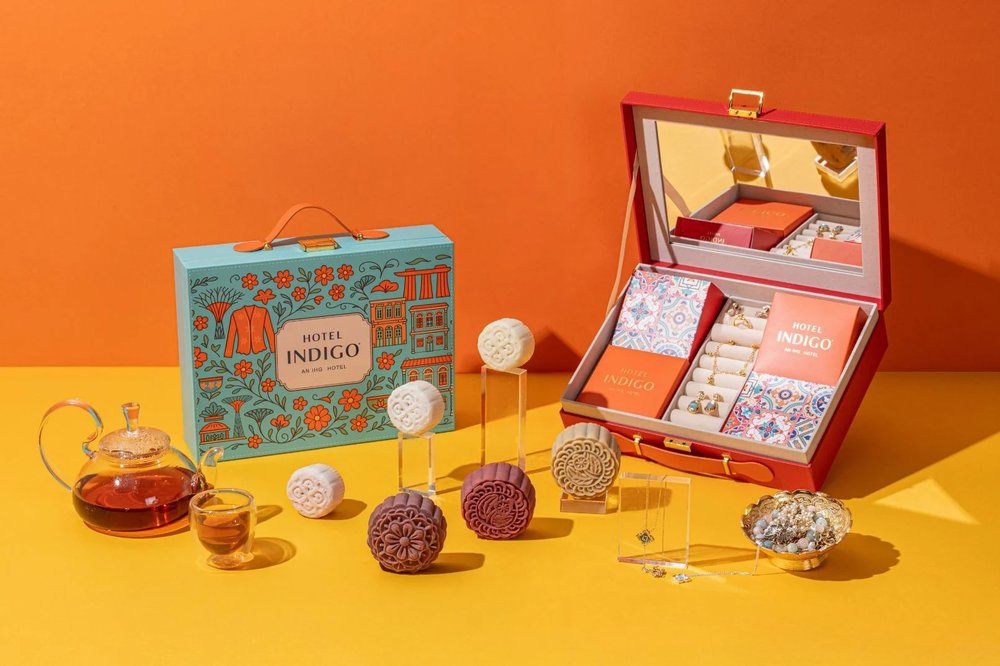 mooncakes displayed alongside elegant mooncake boxes