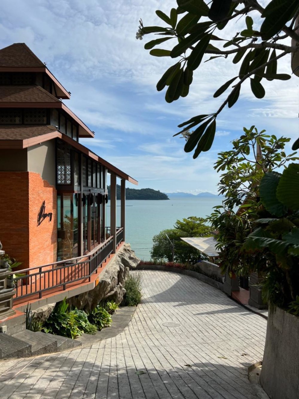 Ocean-view path leading to the restaurant at Sinae Phuket Resort