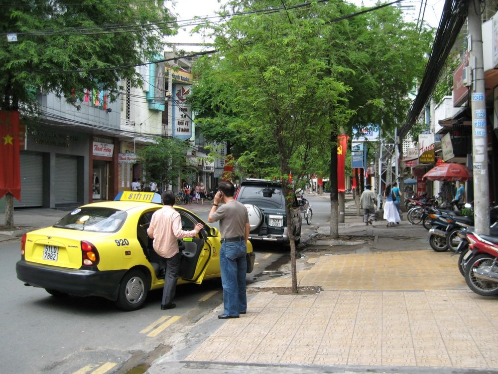 Passenger entering taxi