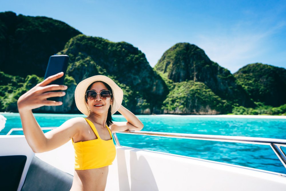 girl taking a selfie on a boat