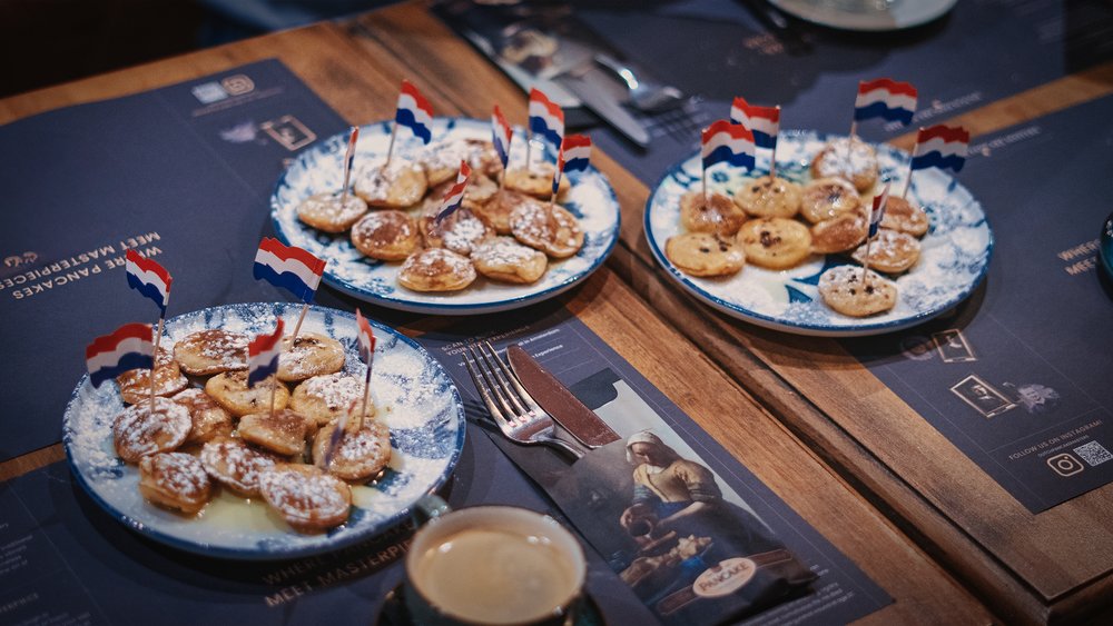 Classic Dutch poffertjes topped with powdered sugar