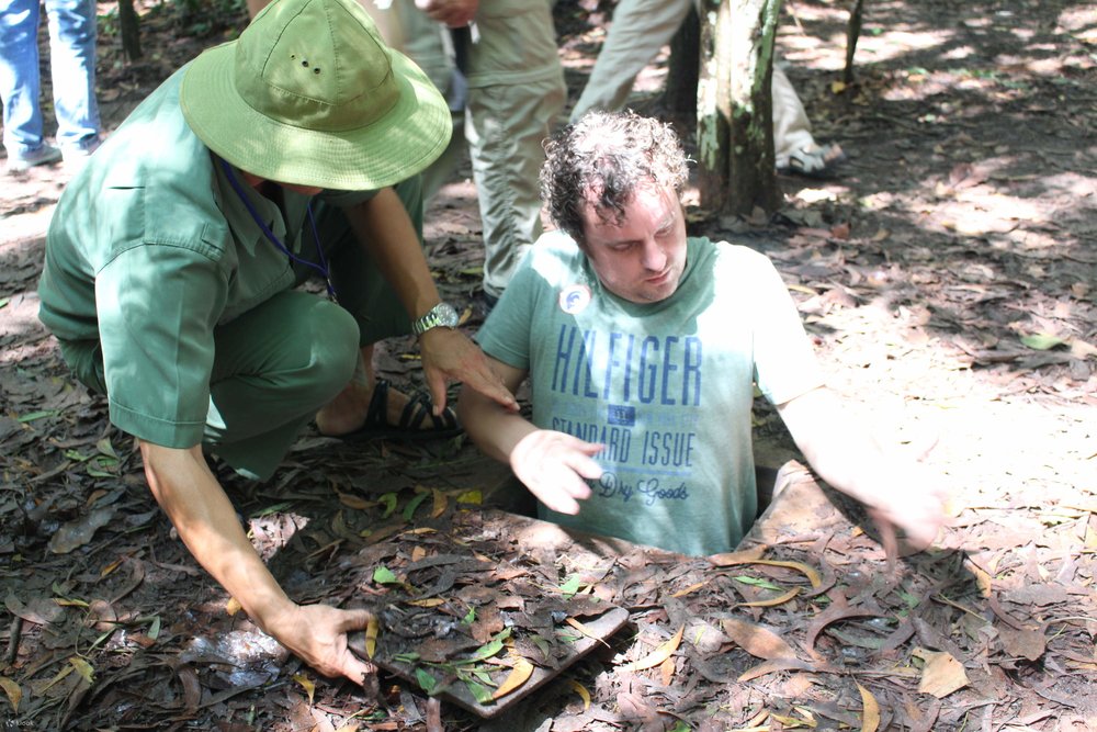 man entering cu chi tunnels
